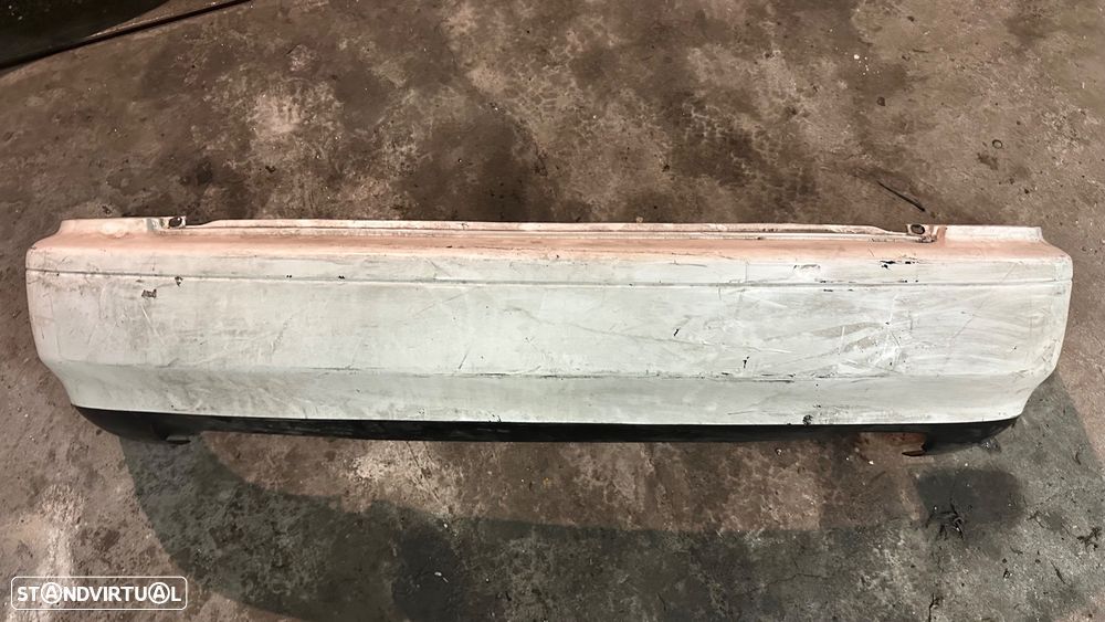 Parachoque Mazda 323 traz - 1