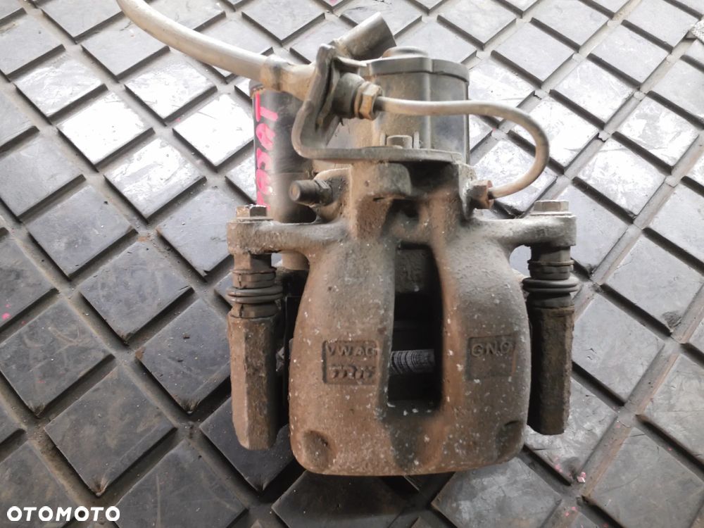 ZACISK HAMULCA PRAWY TYŁ PASSAT B6 ELEKTRYCZNY - 1