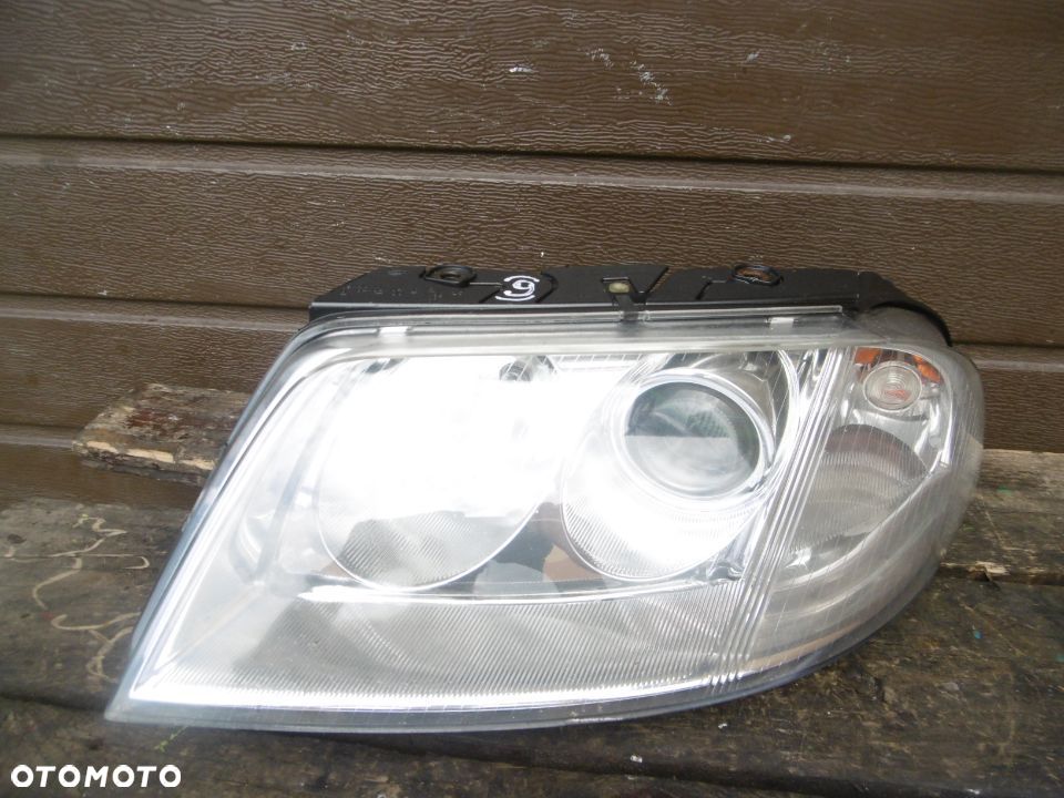 Lampa lewa VW PASSAT B5 LIFT HELLA EUROPA - 1