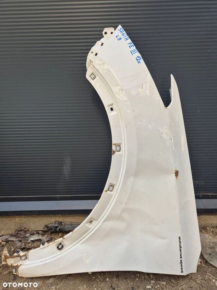 BŁOTNIK SANTA FE III 12r LEWY PRZÓD BIAŁY - 1