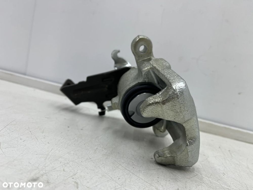 Zacisk hamulcowy Nissan Almera N16 Almera Tino Primera P11 96-06r. NOWY lewy tylny zacisk lewy tył - 2