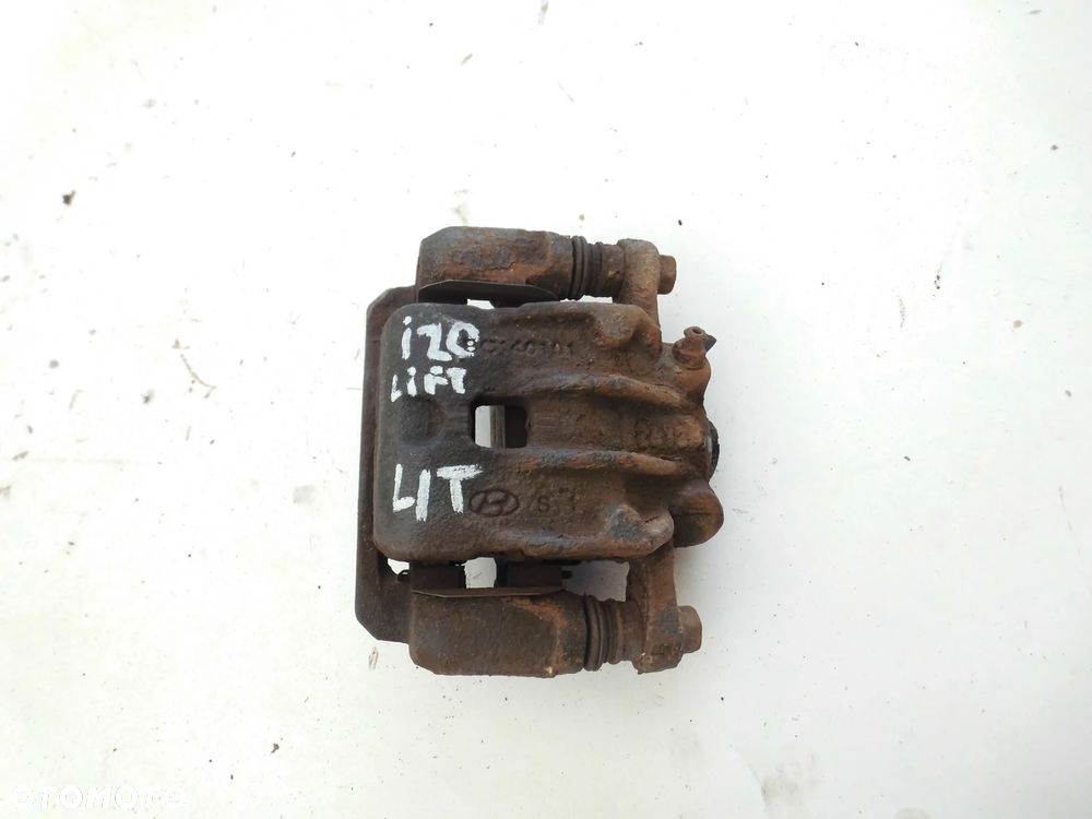 ZACISK HAMULCOWY HYUNDAI I20 LIFT LEWY TYLNY ORYGINAŁ