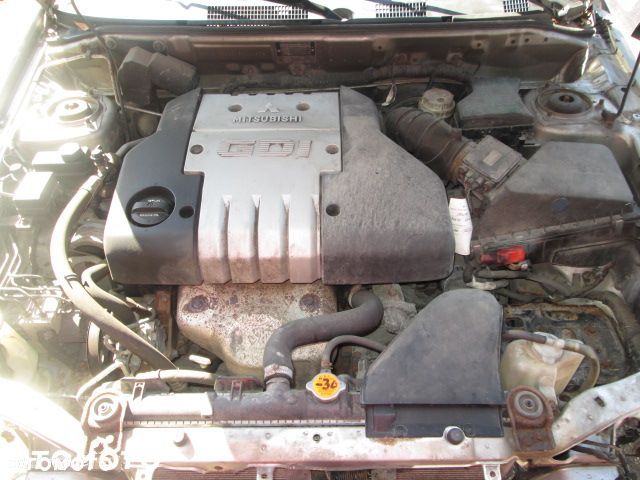 PÓŁOŚ MITSUBISHI CARISMA 00-04 1,8GDi PRAWA - 2