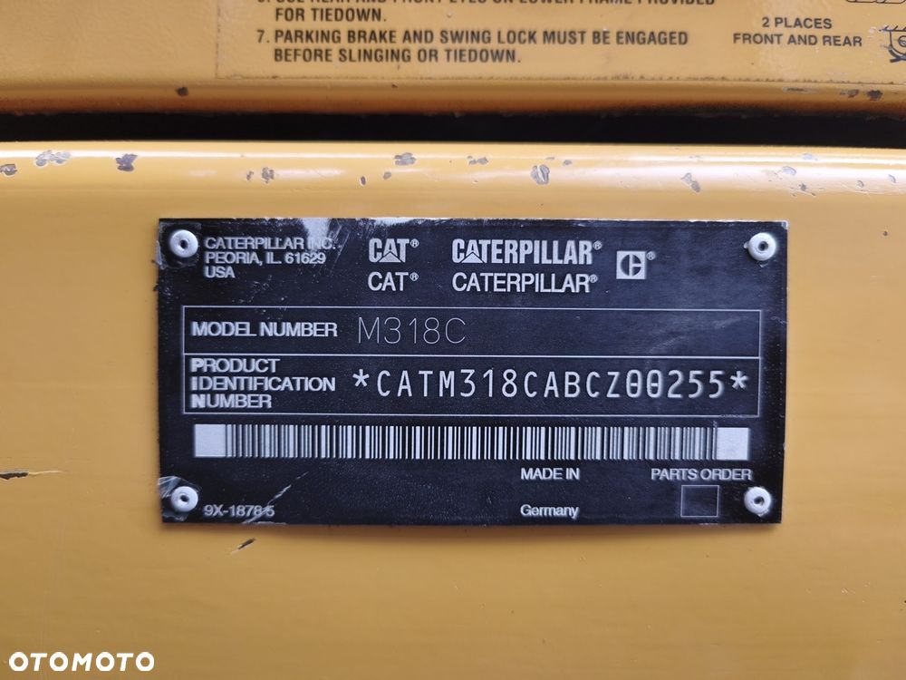 Caterpillar M318C - 12