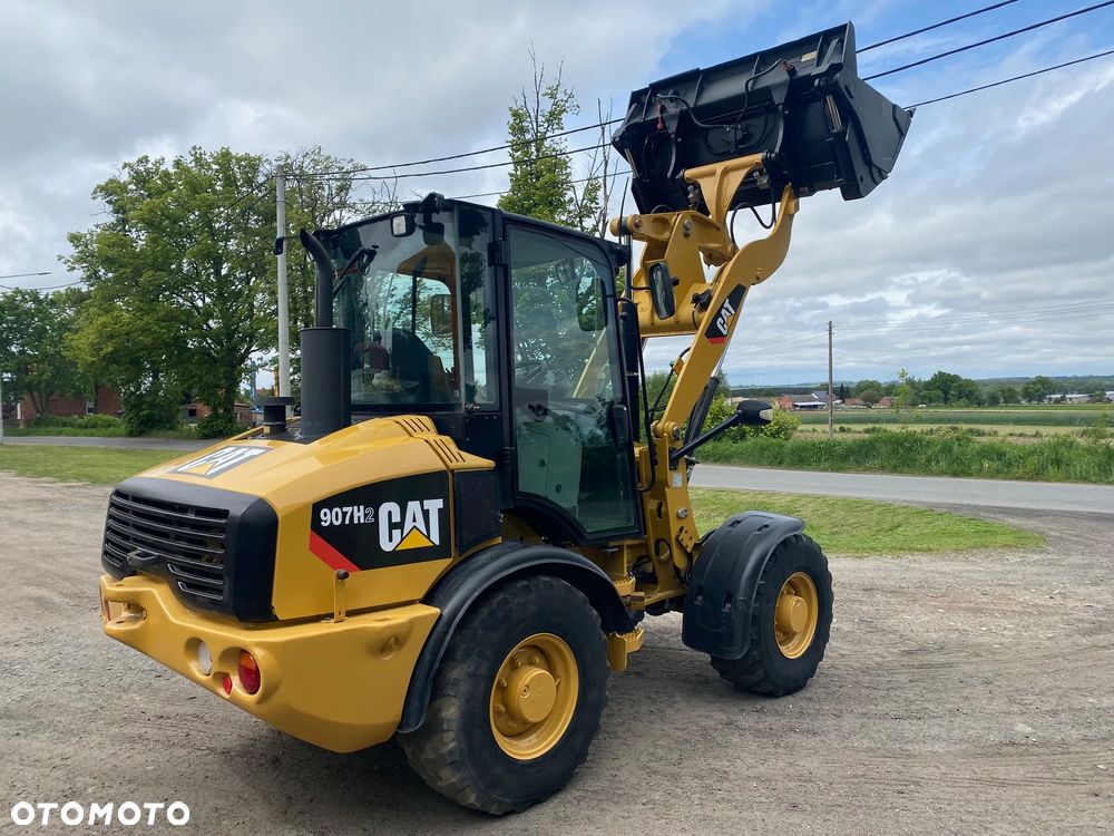 Caterpillar CAT 907H2, 2014 ROK, 4900 MTH, ŁYŻKA OTWIERANA + WIDŁY, z NIEMIEC, - 17