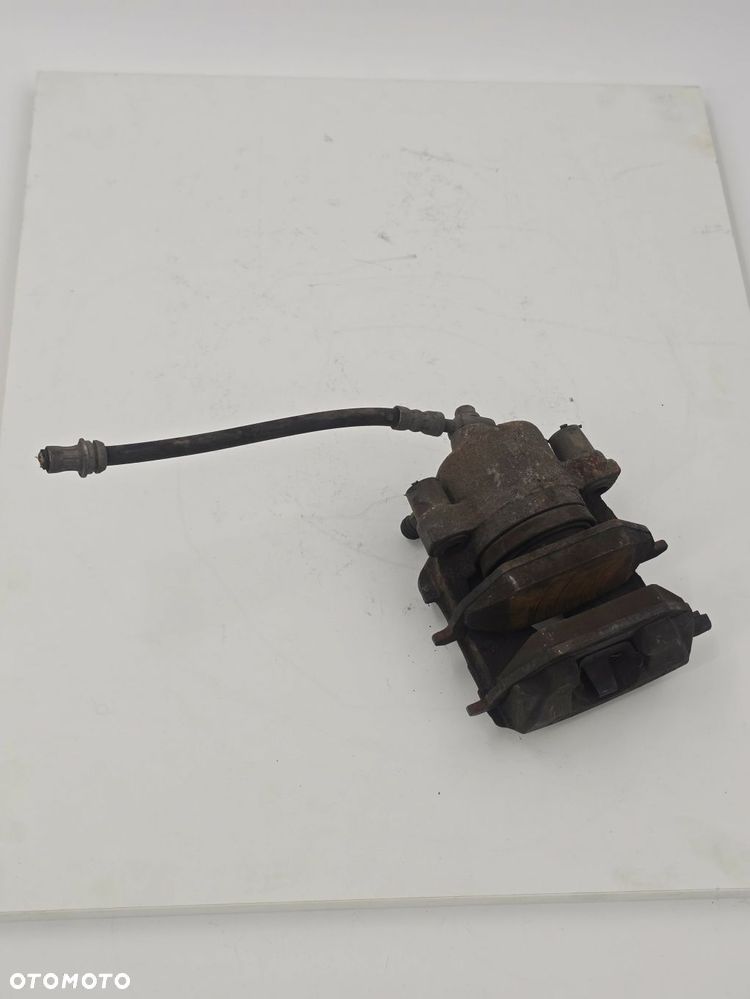 ORYGINALNY ZACISK HAMULCOWY PRAWY PRZÓD SKODA FABIA 1K0615123E