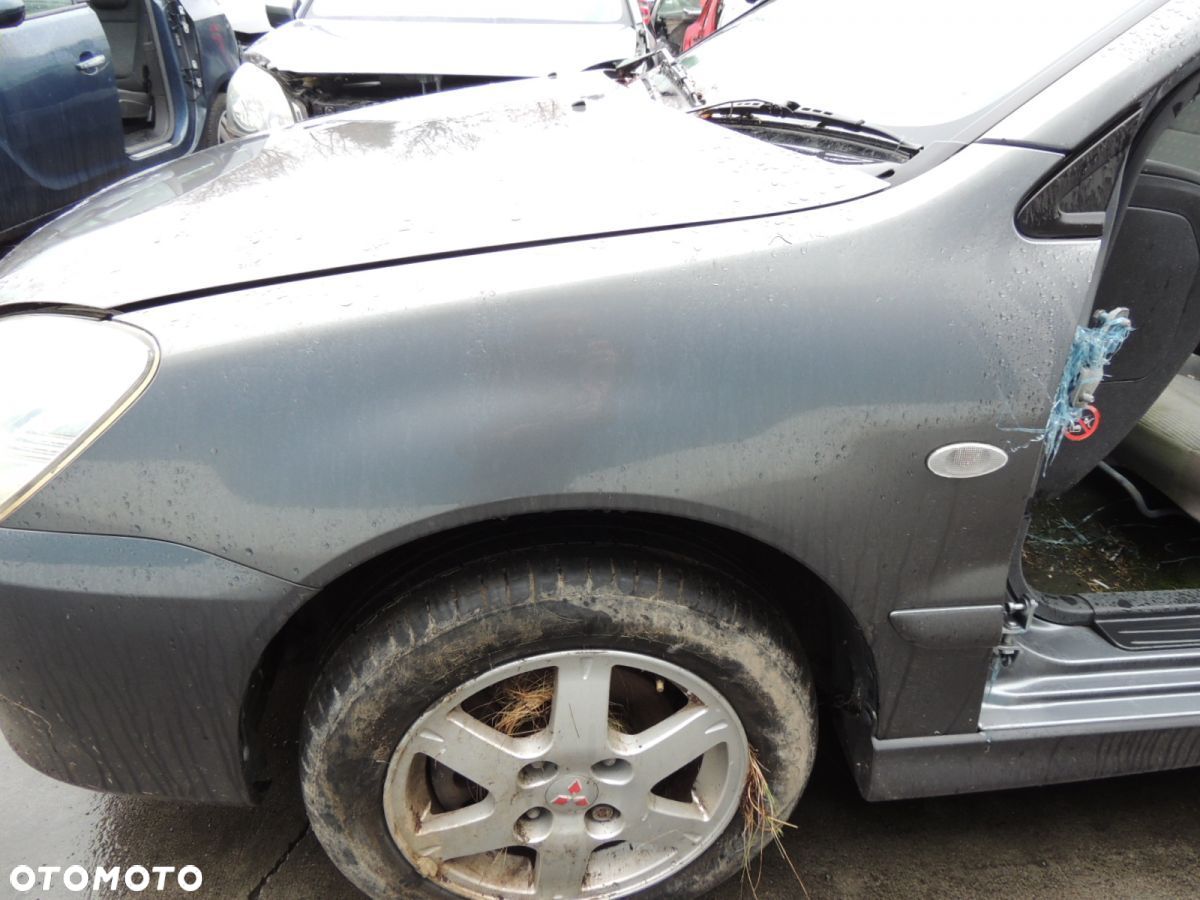 Błotnik lewy Mitsubishi Lancer 7 '06 - 1
