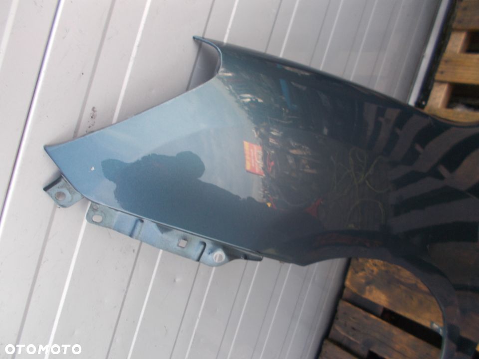 BŁOTNIK LEWY PRZÓD KIA CARENS III 06-11 - 2