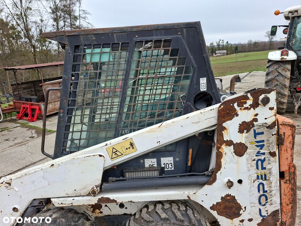 Bobcat 553 4X4 + Melroe Ingersoll-Rand 725S B/H - 32