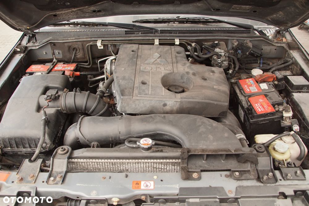 Auto na części 692106889 Mitsubishi Pajero IV 3.2 DID LIFT 4M41U 200KM 2014 krótki zderzak lampa felgi skrzynia silnik głowica deska amortyzator błotnik skrzynia wydech tłumik ćwiartka lampa klapa szyba tylna fotele - 3
