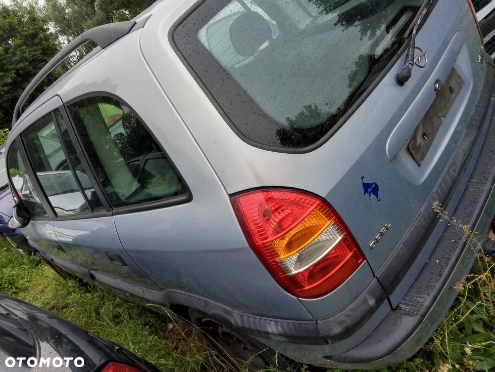 Opel Zafira A (99-03r.) 2.0 DTI 100KM. Silnik Y20DTH Skrzynia F23 WR lakier Z 151 / 94L.Cały na części.GWARANCJA !!! Przód Tył Zestaw Komplet Drzwi Klapa Zderzak Błotnik Maska Grill Atrapa Szyba Pas Lampa Lusterko Boczki Fotel Kanapa Kokpit Deska Rozdzielcza Przełącznik Włącznik Sterownik Przewody Wiązka Instalacja Moduł Komputer Czujnik Listwa Pompa Alternator Wtryski Głowica Rozrusznik Kompresor Sprzęgło Dwumas Silnik Skrzynia ABS Klimatyzacji Paliwa Wspomagania Kolektor Turbina Przepustnica Zawór Chłodnica Koło Hak Belka Sanki Zawieszenie Mcpherson Półoś Amortyzator Wydech Tłumik Zacisk Most - 5