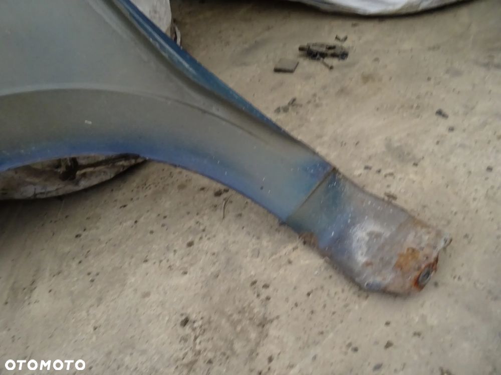 Błotnik Opel Meriva A prawy przód granatowy - 7