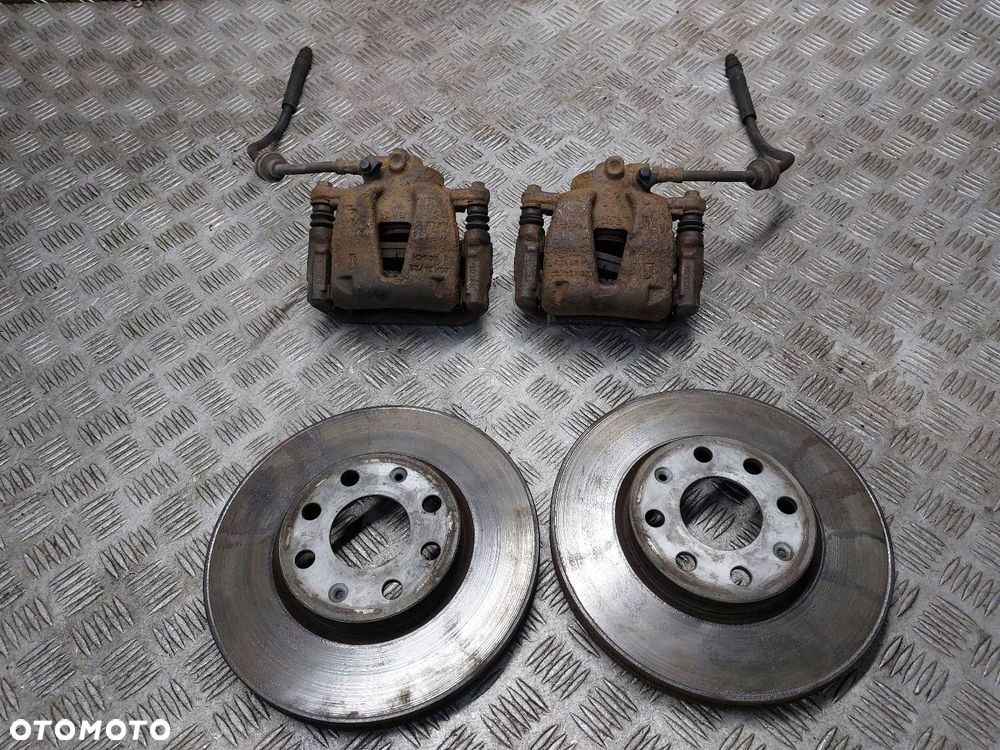 TARCZE HAMULCOWE PRZÓD + KLOCKI + ZACISKI OPEL CORSA D 1.3 CDTI - 1