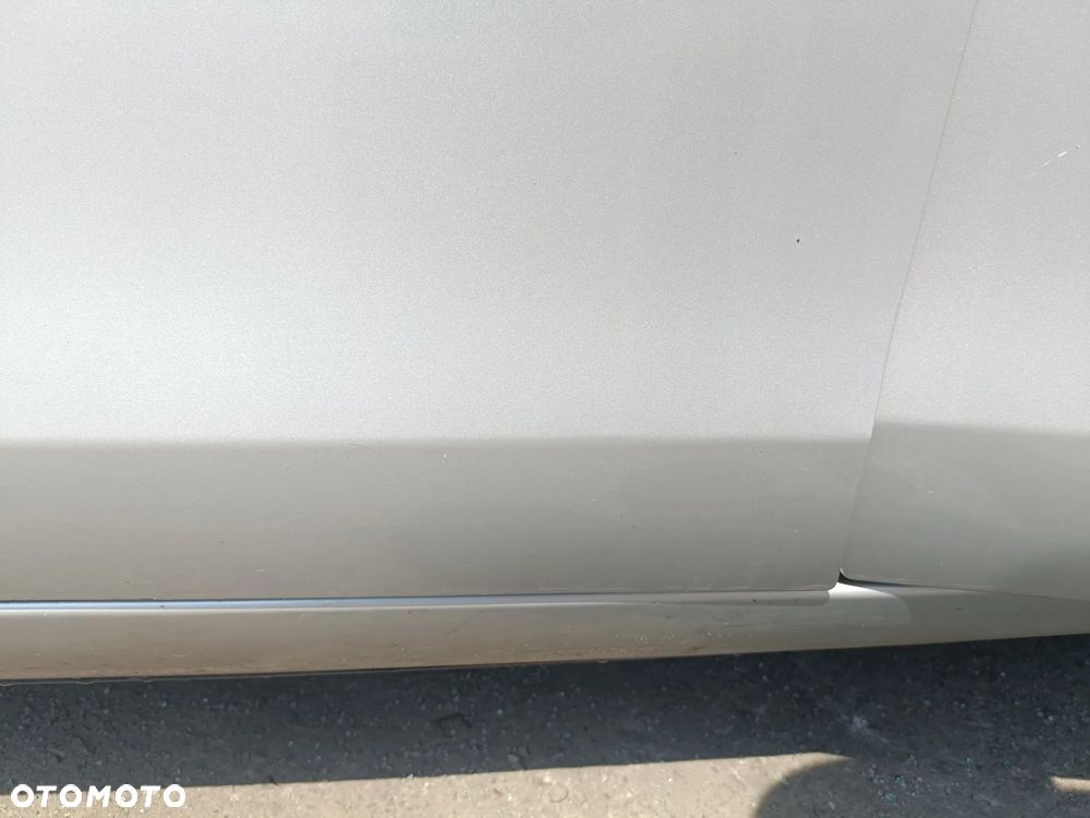 TOYOTA YARIS II 05-11 LIFT 2009 r. 1E7 5D HB drzwi lewy przód LP srebrne * - 5
