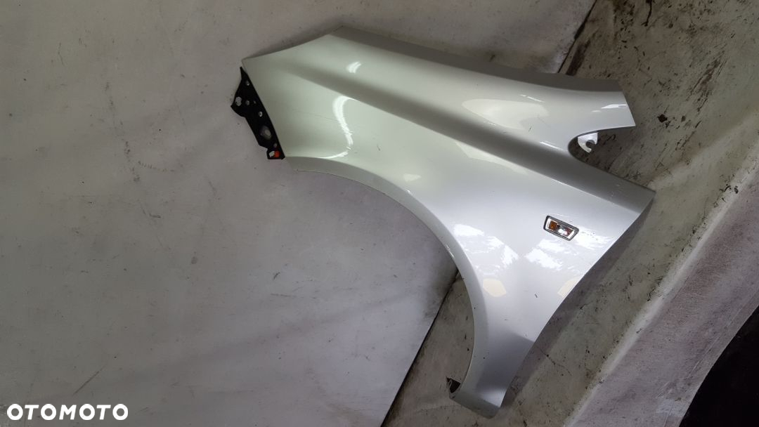 * BŁOTNIK PRZÓD PRZEDNI LEWY OPEL CORSA D Z157 SREBRNY - 2