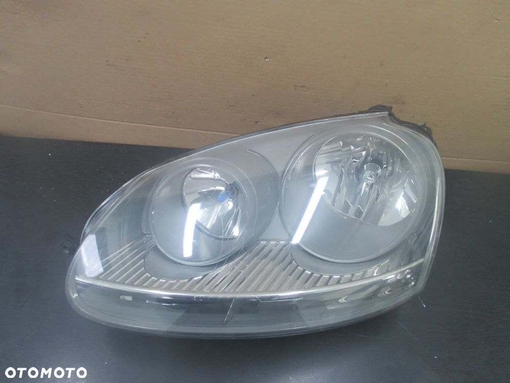lampa lewa Golf V JETTA Hella Europa - 1