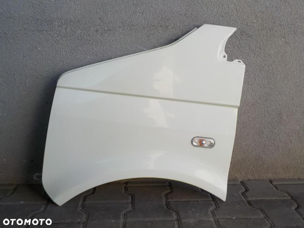 VW T5 03- BŁOTNIK LEWY BIAŁY L902 W KOLOR - 1