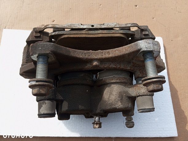 Zacisk lewy przedni Ford Edge II 3.5V6 2014- - 2