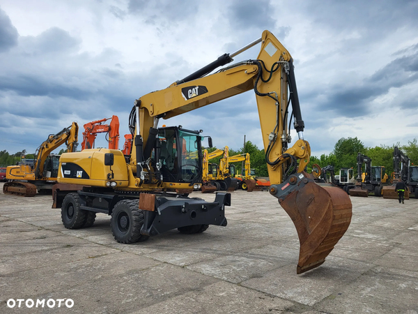 Caterpillar M 322 D pług+podpory spr z Niemiec