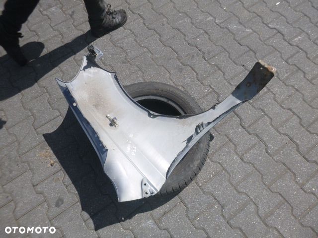 BŁOTNIK LEWY PRZÓD LEWY PRZEDNI TOYOTA YARIS I LIFT KOLOR 855 - 12