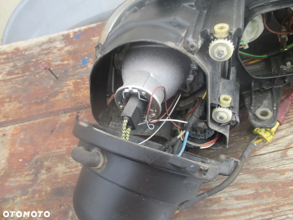 lampa lewa Passat B5 LIFT Xenon Hella Europa - 8