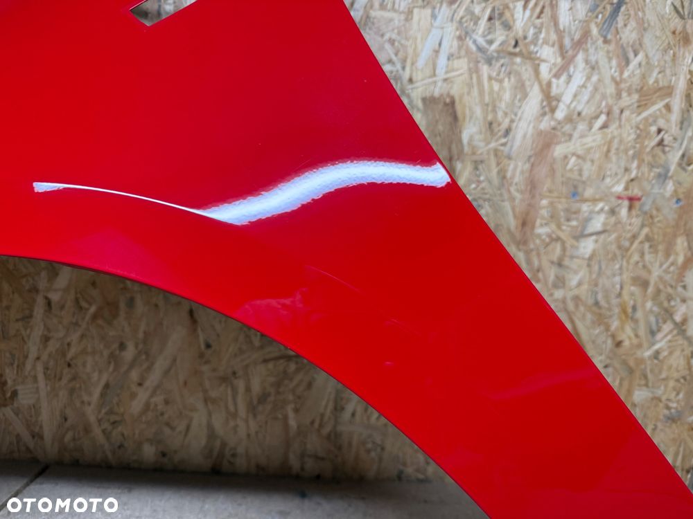 BŁOTNIK LEWY PRZÓD LEWY PRZEDNI OPEL CORSA E CZERWONY 50B - 26