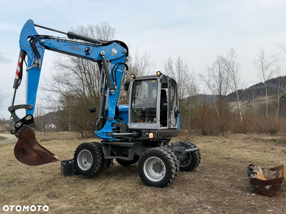Wacker Neuson EW100 Koparka Kołowa 11 ton. NISKI PRZEBIEG.  3x łamane Ramię. Klima. Pompa ON. 2 Łyżki. Dodatkowe 3 sekcje Hydrauliczne. z upadłośći Norweskiej. Maszyna Jak Nowa z salonu! 2799 mtg. PERKINS silnik 130km. STABILIZATORY Klima. DEKRA 2026r. Książka serwisowa. Szybkozłącze Hydr. Skrętne ramie. Ani deka luzów i wycieków. Pełny Oryginał. Nie picowana na sprzedaż. OKAZJA - 1