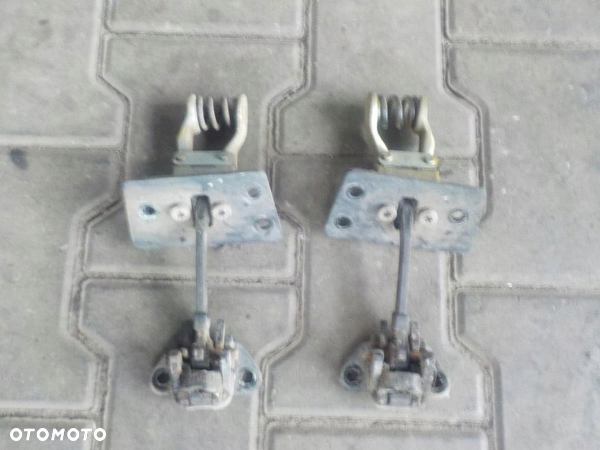 VW T5 T6 OGRANICZNIK DRZWI TYŁ PRAWY  LEWY