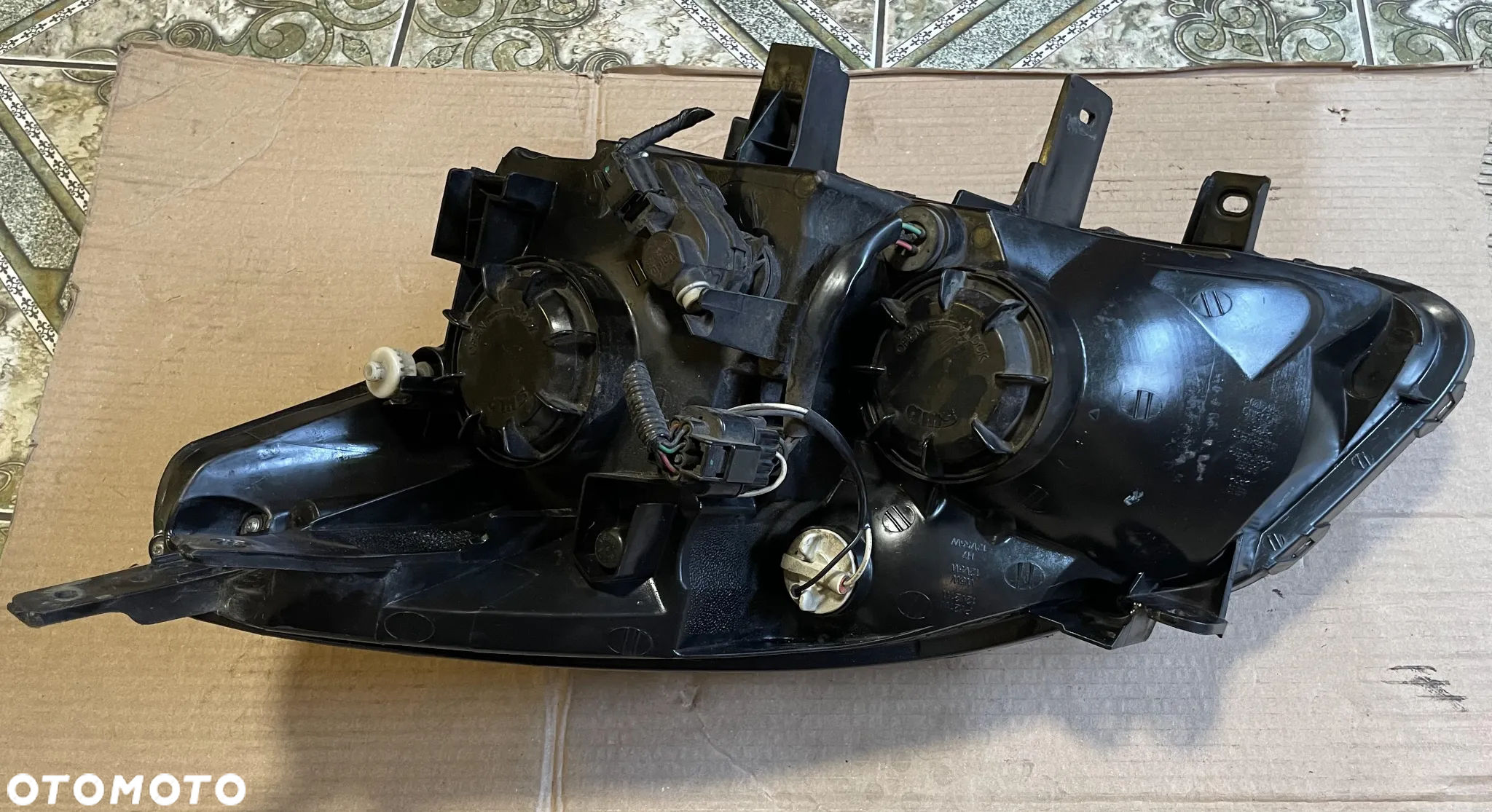 Lampa prawy przód Renault Koleos I Europa - 08-12r. - 2