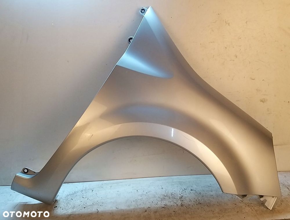 RENAULT MODUS BŁOTNIK PRZEDNI PRAWY SREBRNY - 1