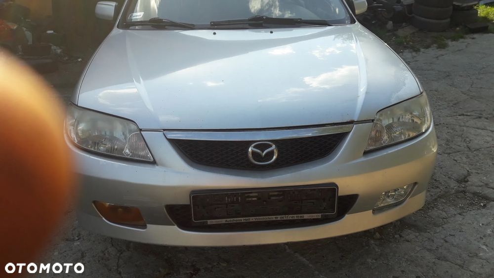 Mazda 323 323f BJ 01-03 Lift  Maska lampa zderzak pas atrapa 22V - 11