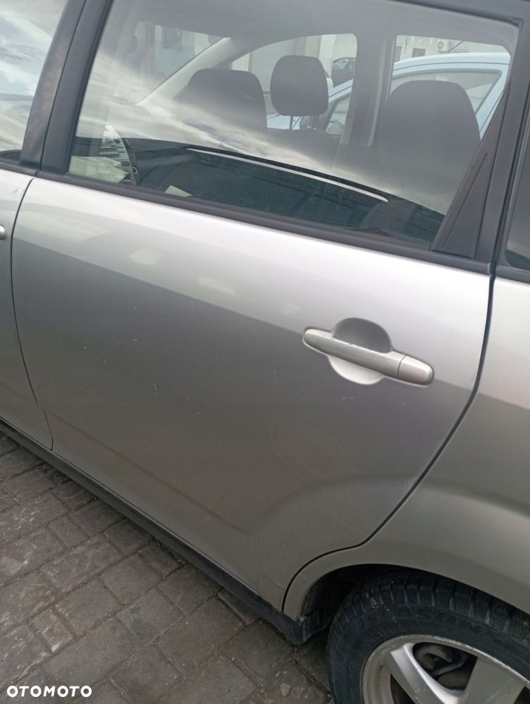 TOYOTA COROLLA VERSO II DRZWI LEWE TYŁ TYLNE GOŁE - 1