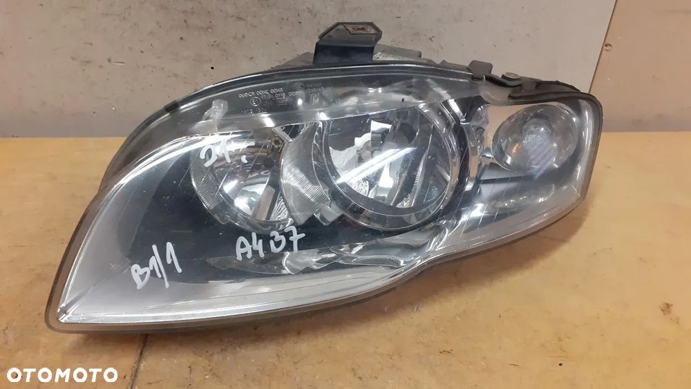 X. LAMPA PRZOD PRZEDNIA LEWA AUDI A4 B7 - 1