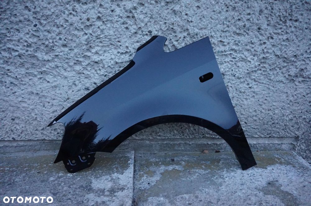 BŁOTNIK PRZEDNI LEWY VW CADDY III LIFT 10/15r LC9X - 4