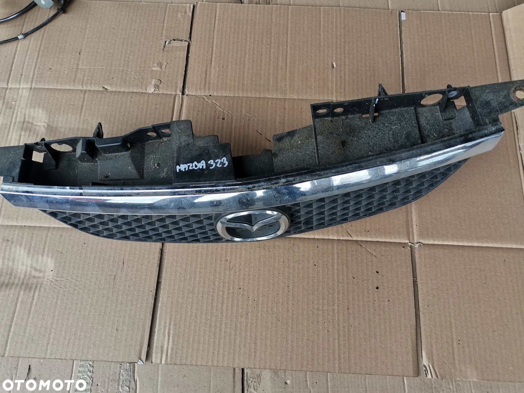 Grill ATRAPA MAZDA 323F BJ - 1