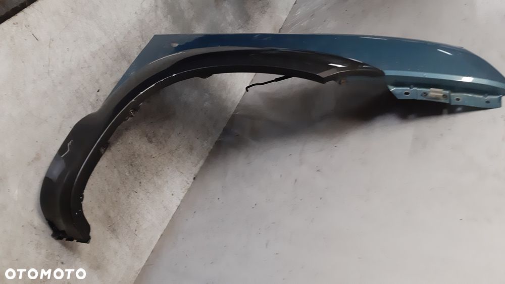 * Hyundai Tucson I 1 błotnik PRAWY  przedni przód MORSKI KOLOR HE - 2