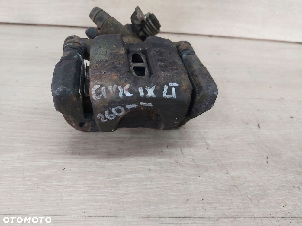 Honda Civic IX 9 zacisk jarzmo lewy tył 11-17r SEDAN 1,8 - 1