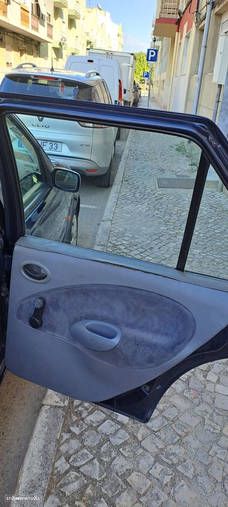 Ford Fiesta 1.25 Ghia - 10