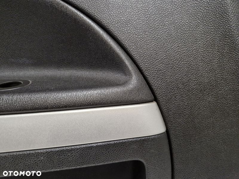 chevrolet hhr boczek drzwi lewy przód przedni tapicerka 15923679 - 3