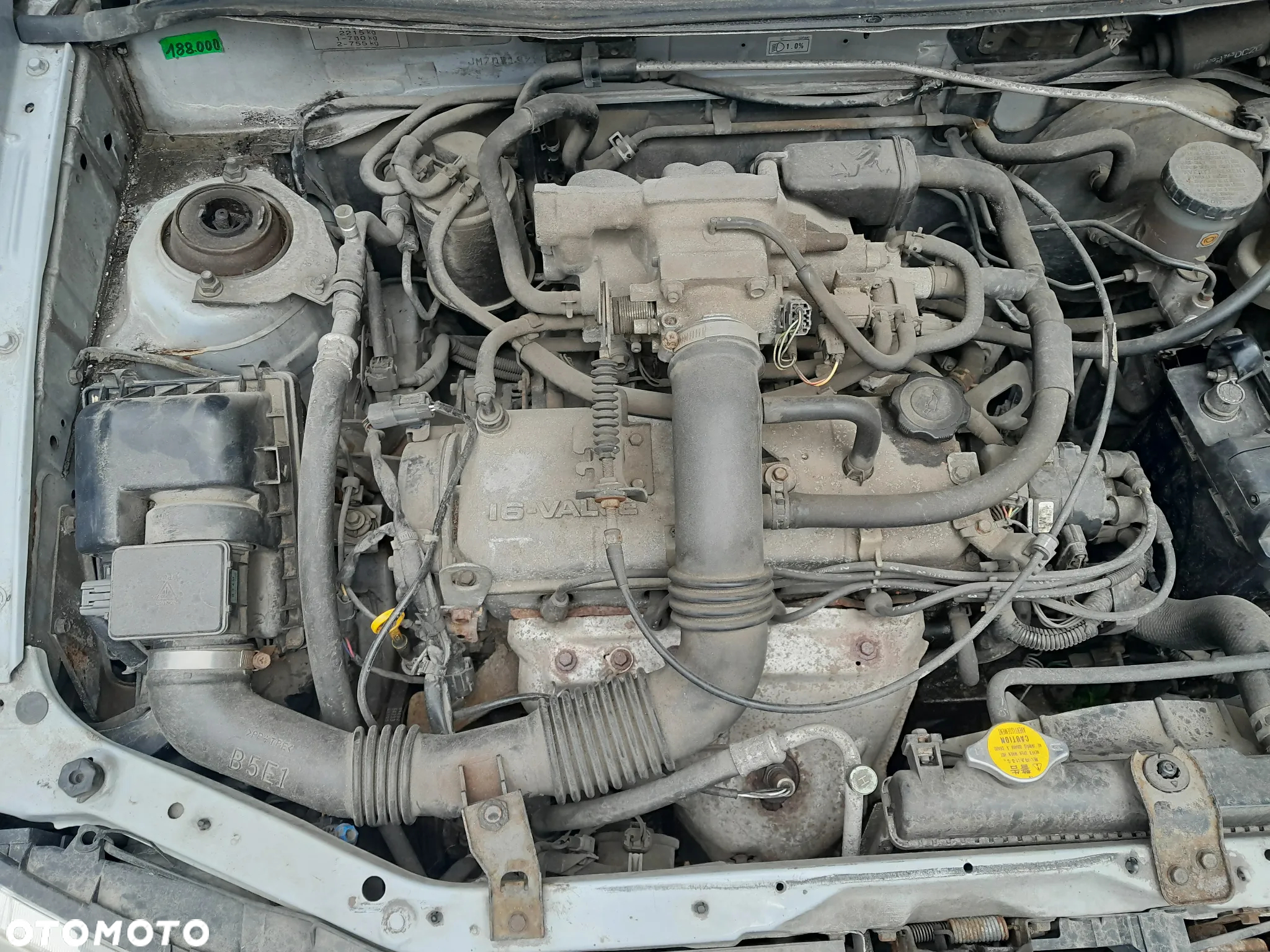 Mazda Demio  Amortyzator Sprężyna przód przedni - 5