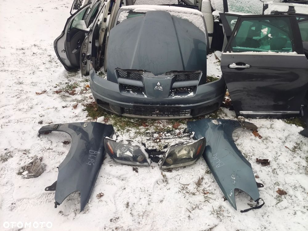 Mitsubishi Outlander I 1 zderzak przód przedni kompletny