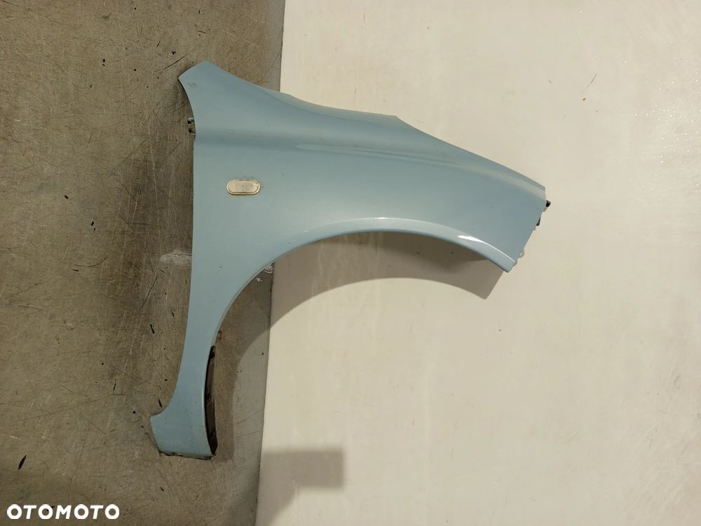 BŁOTNIK PRZÓD PRZEDNI PRAWY NISSAN MICRA K12 B32 JASNO BŁEKITNY - 1