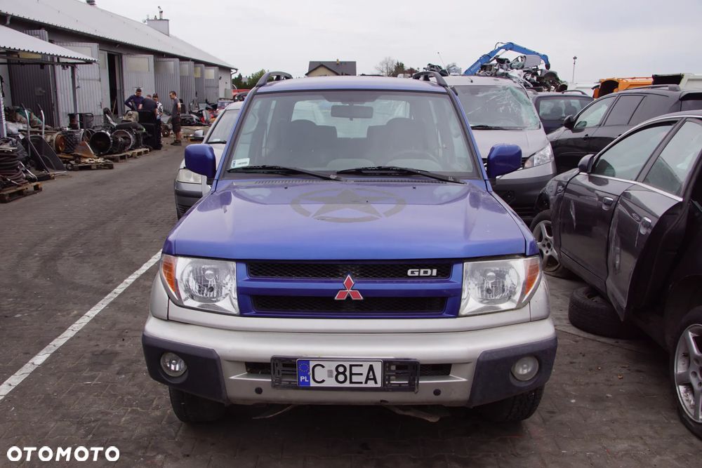 Auto na części - Mitsubishi Pajero Pinin 2.0 GDI 129 KM 4G94 V5M21 TH9B 2003R Silnik Skrzynia Drzwi Maska Błotnik Klapa Zderzak Lampa Lusterko Klamka Szyba Deska Kokpit Sterownik Moduł Czujnik Licznik Wyświetlacz Panel Kierownica - 2