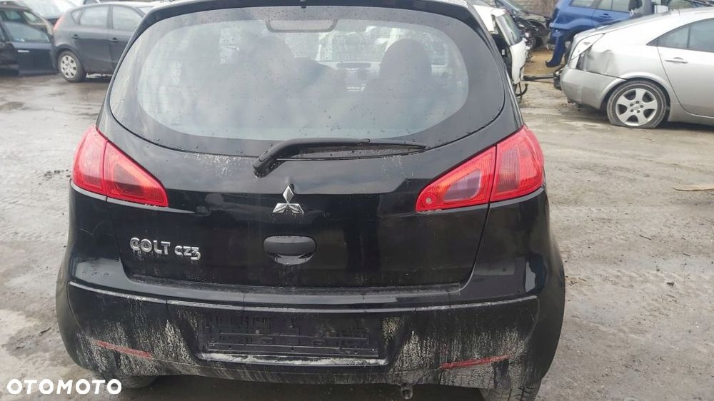 MITSUBISHI COLT VI 3D LAMPA LEWY TYL W BLOTNIK - 7