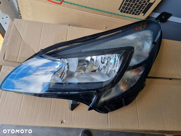 OPEL CORSA E LAMPA LEWA PRZÓD PRZEDNIA ORYGINAŁ 39108222