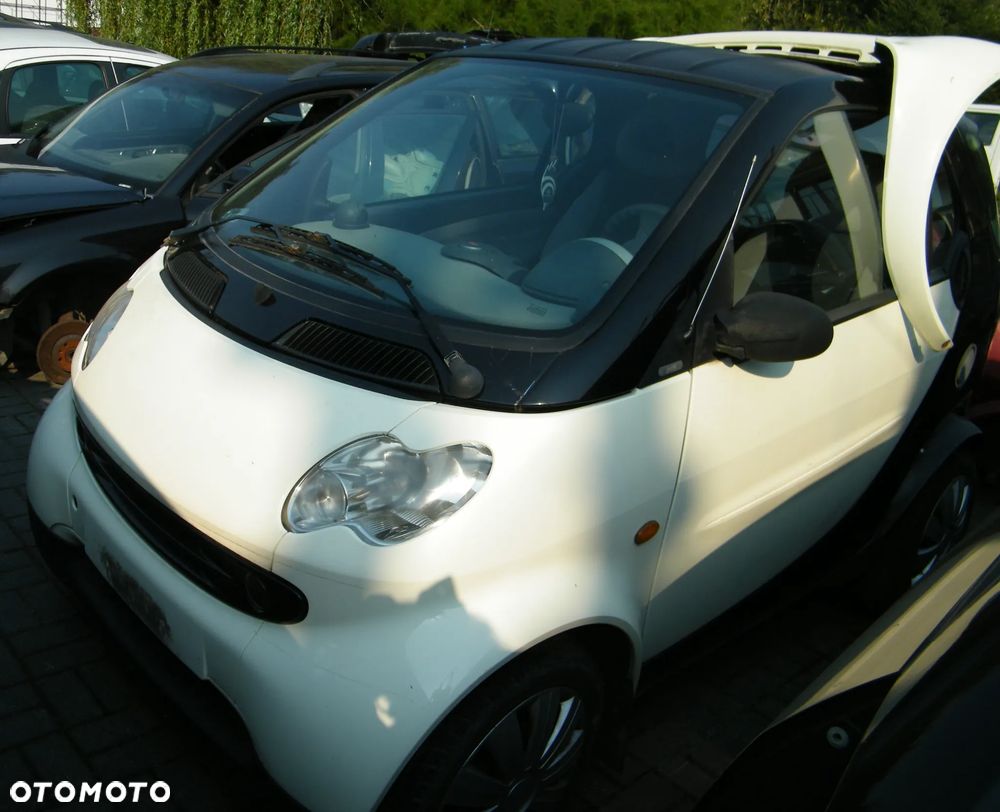 KOMPLETNY PRZÓD Smart ForTwo (Po Lift) (03-07r.) EB1  +  EA8 (Phat Red) kolor lakier Ecru + Czarny  Europa MASKA ZDERZAK BŁOTNIKI LAMPY PAS PRZEDNI BELKA CHŁODNICE PLASTIKI PODSZYBIA / PODSZYBIE do założenia bez malowania. - 2