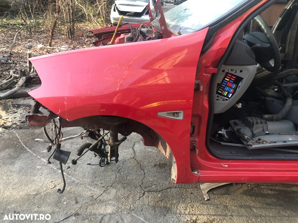 Aripa stanga fata Renault Clio Thalia 2011 rosu - 3