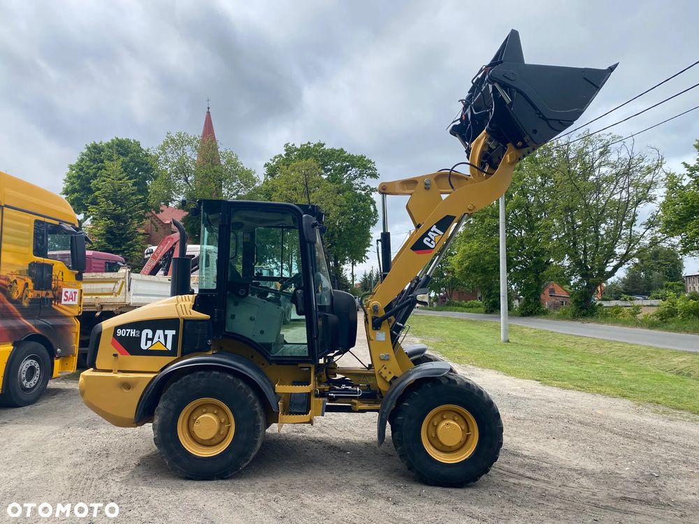 Caterpillar CAT 907H2, 2014 ROK, 4900 MTH, ŁYŻKA OTWIERANA + WIDŁY, z NIEMIEC, - 16