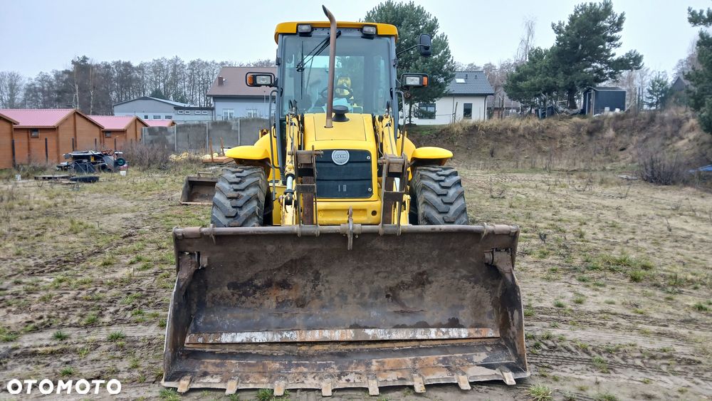 New Holland LB 115 - 6