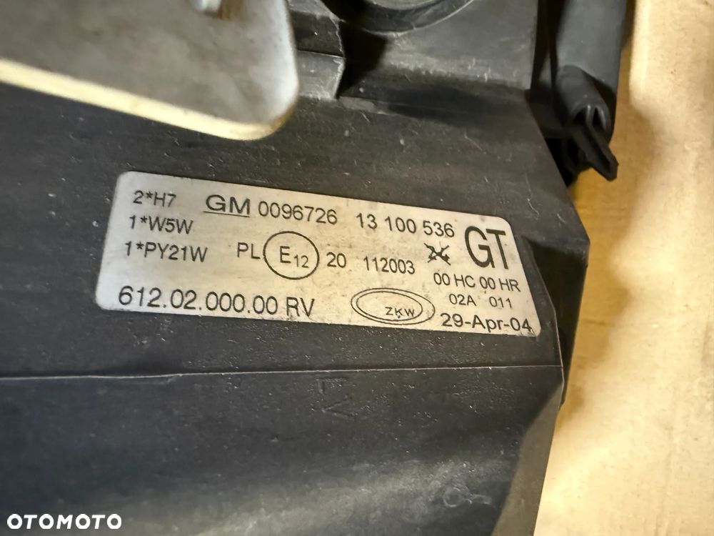 Lampa Opel Corsa C lift 13100536 prawa 13100535 lewa OE - 8